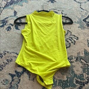 SKIMS Yellow Bodysuit with High-Cut Leg and Sleeveless Design